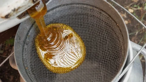Honey flowing through filters
